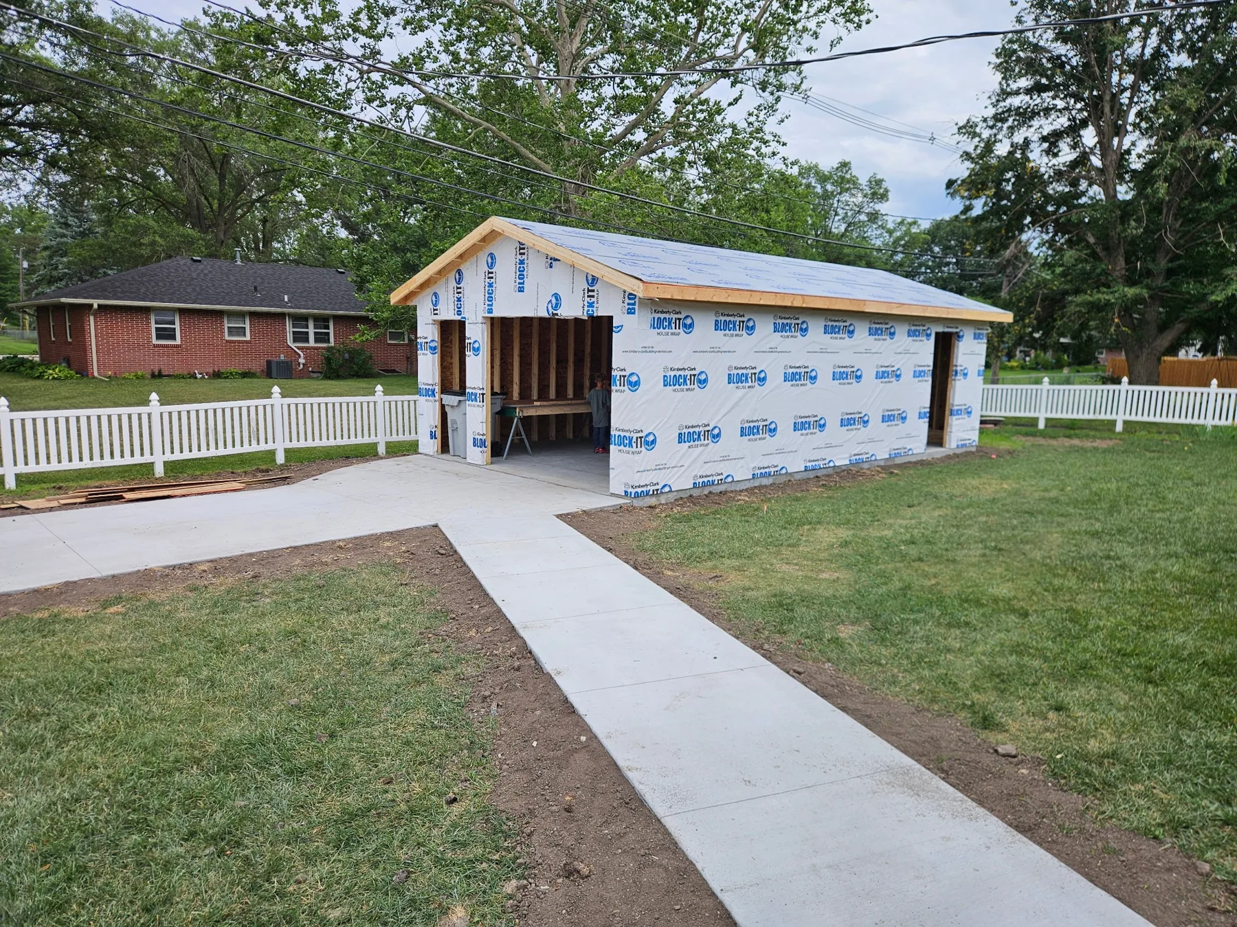 Garage weather barrier stage